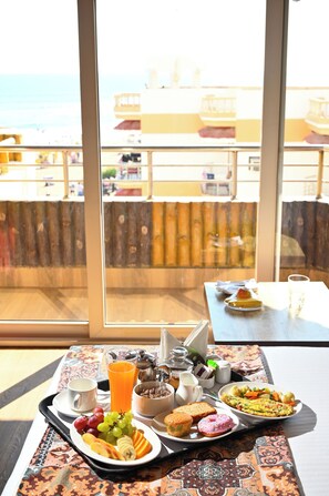 Cottage, Partial Sea View | Breakfast meal | Daily continental breakfast (INR 500 per person)