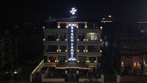 A multi-story hotel with a prominent sign reading "ECKO BEACH FRONT HOTEL" and "DEEP RESORT". -  ECKO Beach Front, Puri (Puri)