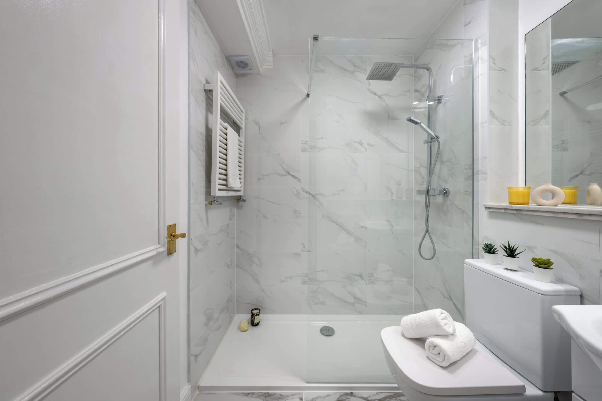 Shower, hair dryer, towels, soap