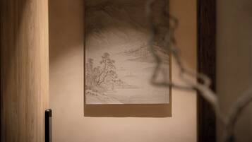 A framed artwork on a wall.