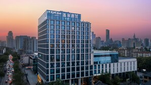 A modern hotel building with a glass facade and signage indicating it is a UrCove by Hyatt hotel. - UrCove by Hyatt Nanjing Confucius Temple (Nanjing)