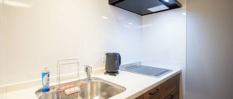 Apartment | Private kitchenette | Fridge, microwave, cookware/dishes/utensils