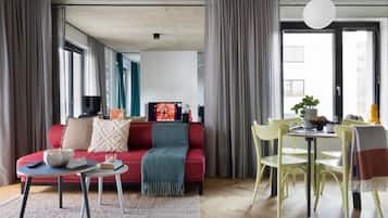 Deluxe Studio Suite, Non Smoking | Living room | TV