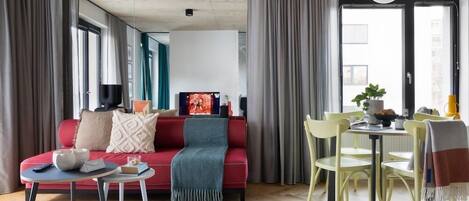 Deluxe Studio Suite, Non Smoking | Living room | TV