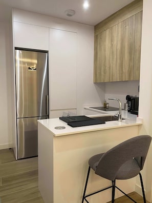 Coffee/tea maker, fridge, microwave, oven