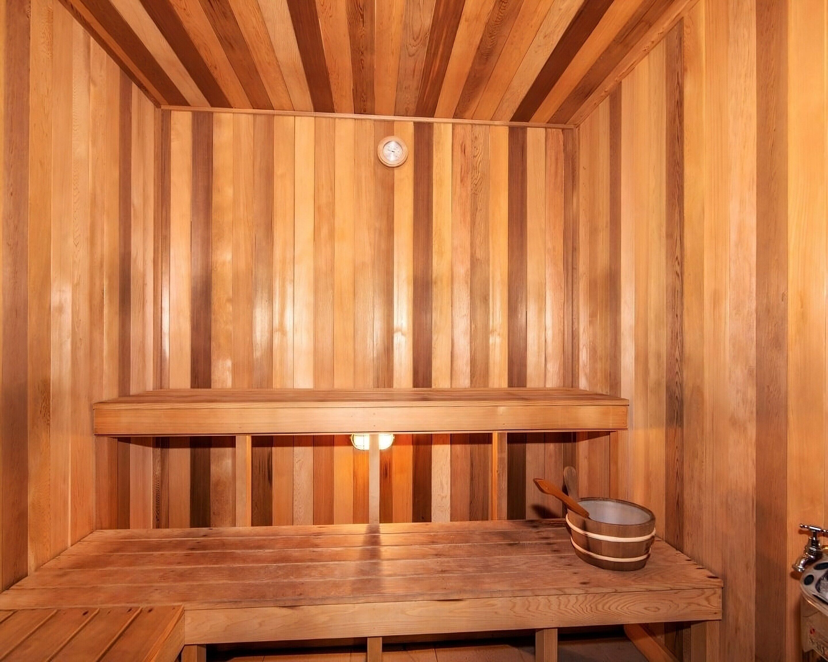 A sauna with wooden walls and benches.