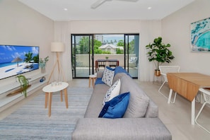 Apartment | Living area - Coastal 2-bed With Parking & Pool by the Ocean (Cairns)