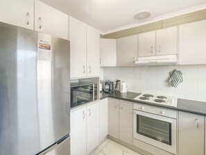 Apartment | Private kitchen | Cookware/dishes/utensils - Serene Coastal Retreat With Carport (North Batemans Bay)