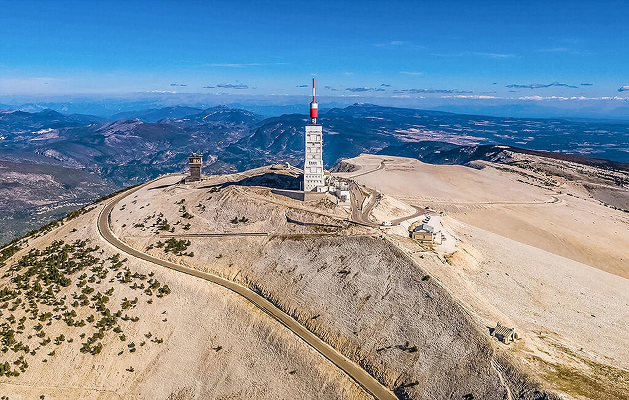 A high-altitude observation tower with a clear view of surrounding mountains and valleys.