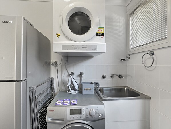 Apartment | Bathroom | Bathtub, hair dryer, towels, soap
