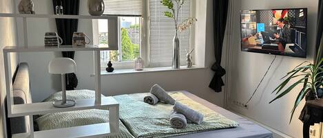 1 غرفة نوم ومكواة/لوح كي وخدمة الإنترنت وملاءات أسرّة