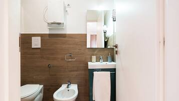 Standard Double Room | Bathroom | Shower, hair dryer, towels, soap