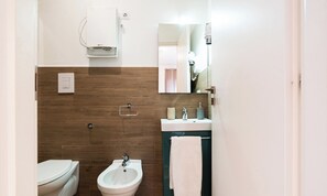 Standard Double Room | Bathroom | Shower, hair dryer, towels, soap