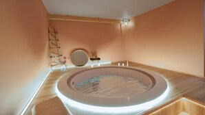 A bathroom with a round sink, a mirror, a ladder, and a vase with flowers. - 1 bedroom stunning apartment in Pieve di Teco (Pieve di Teco)
