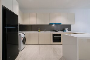 Luxury Suite, 3 Bedrooms, Balcony, City View | Private kitchen | Fridge, oven, stovetop, toaster oven