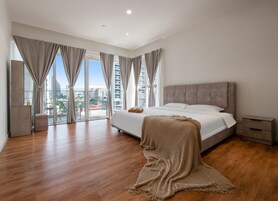 Luxury Suite, 3 Bedrooms, Balcony, City View | Hypo-allergenic bedding, desk, laptop workspace, blackout drapes
