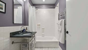 Shower, hair dryer, towels, shampoo