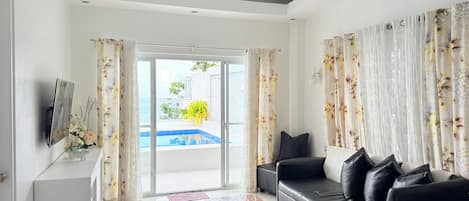 Villa | Living room | 32-inch Smart TV with satellite channels