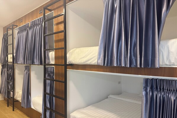 A bunk bed room with curtains and a ladder. - Phukhao Hostel (Chiang Mai)