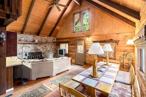 Living area - Log Cabin with Hot Tub, Fire Pit and Spacious Deck Nestled in the Woods of Great Cacapon, WV (Great Cacapon)