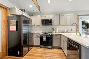 Fridge, stovetop, coffee/tea maker, cookware/dishes/utensils