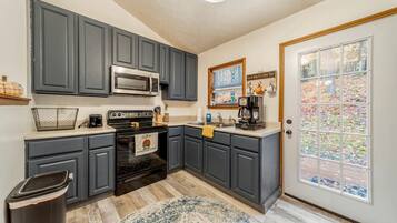 Microwave, stovetop, dining table