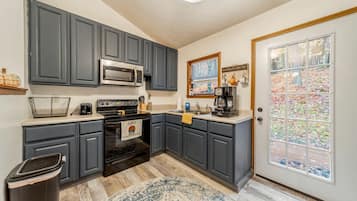 Microwave, stovetop, dining tables