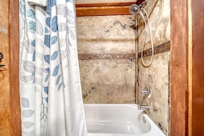 Jetted tub, hair dryer, towels, toilet paper