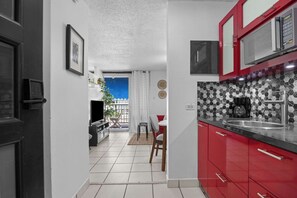 Fridge, microwave, stovetop, coffee/tea maker