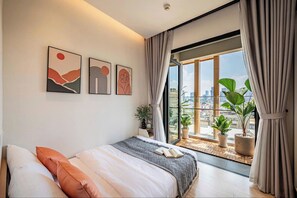 Deluxe Apartment, 2 Bedrooms, Bathtub, City View | Hypo-allergenic bedding, in-room safe, desk, laptop workspace - Zenity Apartment Luxury Ruby (Ho Chi Minh)