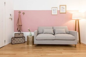 Apartment, 3 Bedrooms | Living area | 32-inch flat-screen TV with cable channels