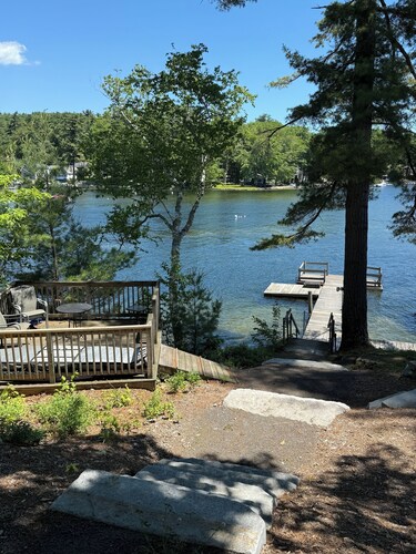 Sebago Lake studio-style condo with enclosed sunroom and sunset views