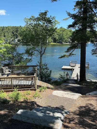 Sebago Lake studio-style condo with enclosed sunroom and sunset views