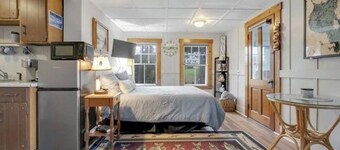 Sebago Lake studio-style condo with enclosed sunroom and sunset views