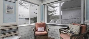 Sebago Lake studio-style condo with enclosed sunroom and sunset views