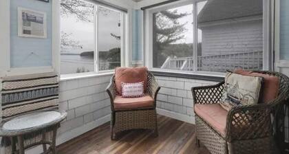 Sebago Lake studio-style condo with enclosed sunroom and sunset views