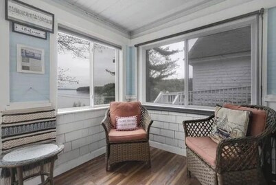 Sebago Lake studio-style condo with enclosed sunroom and sunset views