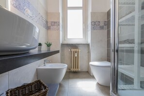 Hair dryer, bidet, towels, soap