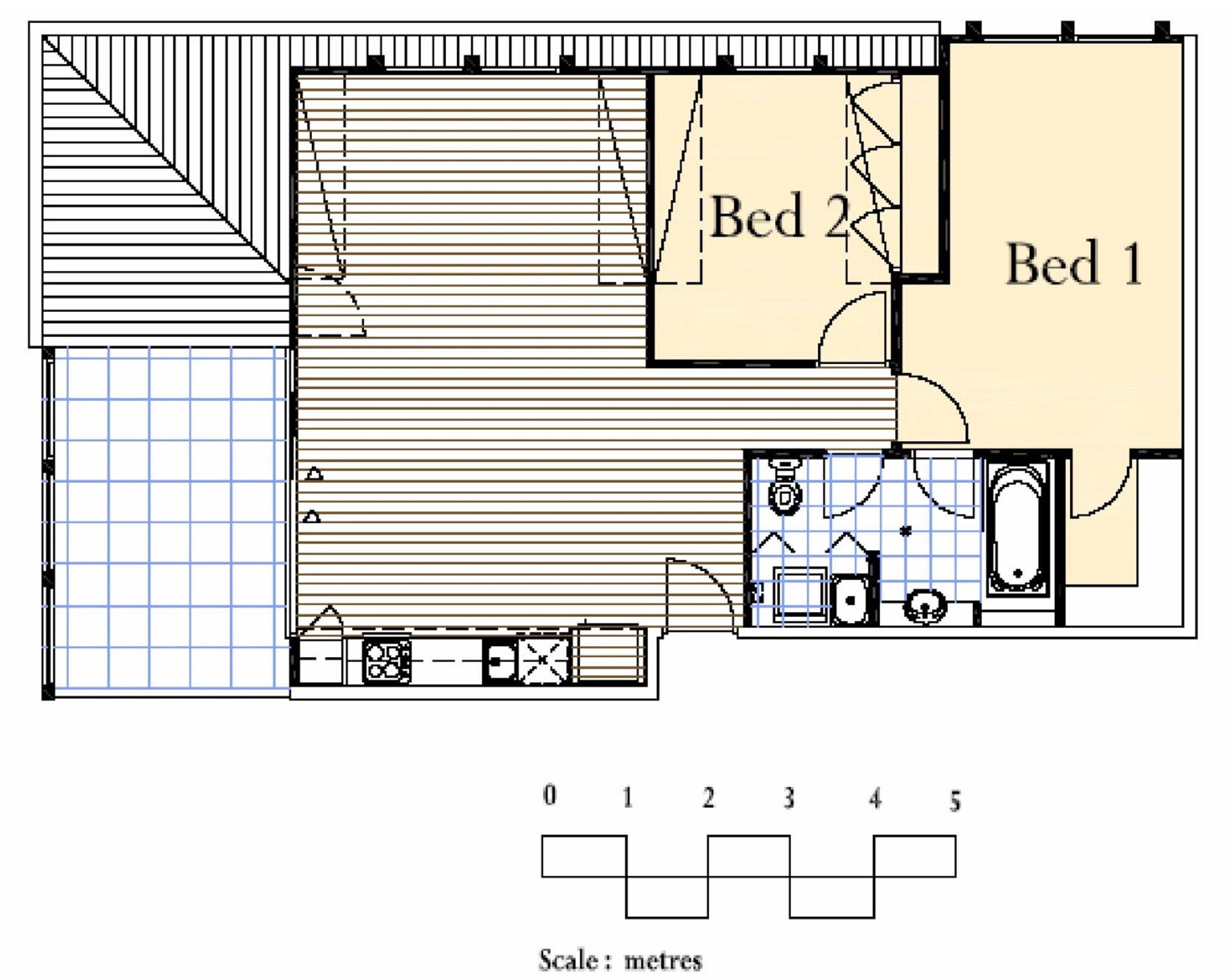 A floor plan of a hotel room with two beds, a bathroom, and a small kitchen area.
