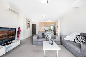 Apartment | Living room - Lakeside Family Oasis With Pool, Gym and Balcony (Gold Coast)