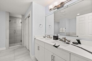 Shower, hair dryer, towels, shampoo