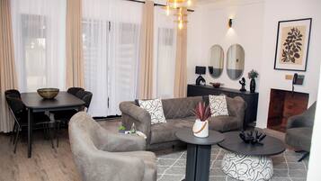 Standard Villa, Balcony | Living area | Flat-screen TV