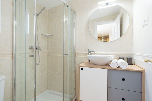 Shower, hair dryer, towels, soap
