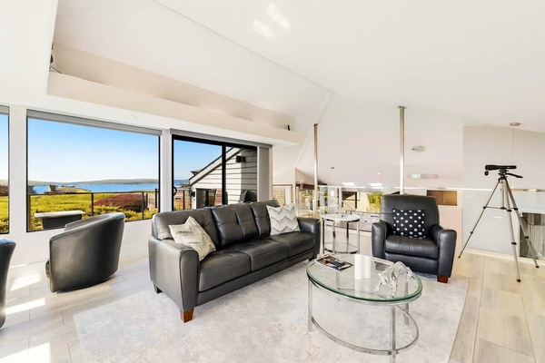 Soak in stunning water views from this bright, modern living space.