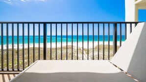 A balcony with a view of a beach and ocean. - Phoenix Vi 61010 2 Bedroom Condo (Orange Beach)