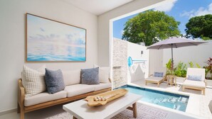 A modern living room with a pool, a sofa with cushions, a coffee table, and a painting on the wall.