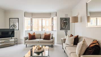 Deluxe Apartment, 2 Bedrooms, Kitchen | Living area | 43-inch Smart TV with digital channels