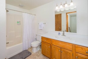 Shower, hair dryer, towels, shampoo