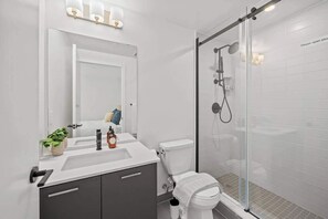 Shower, hair dryer, towels, soap