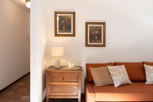 Apartment, 1 Bedroom | Living area | 30-inch TV with satellite channels